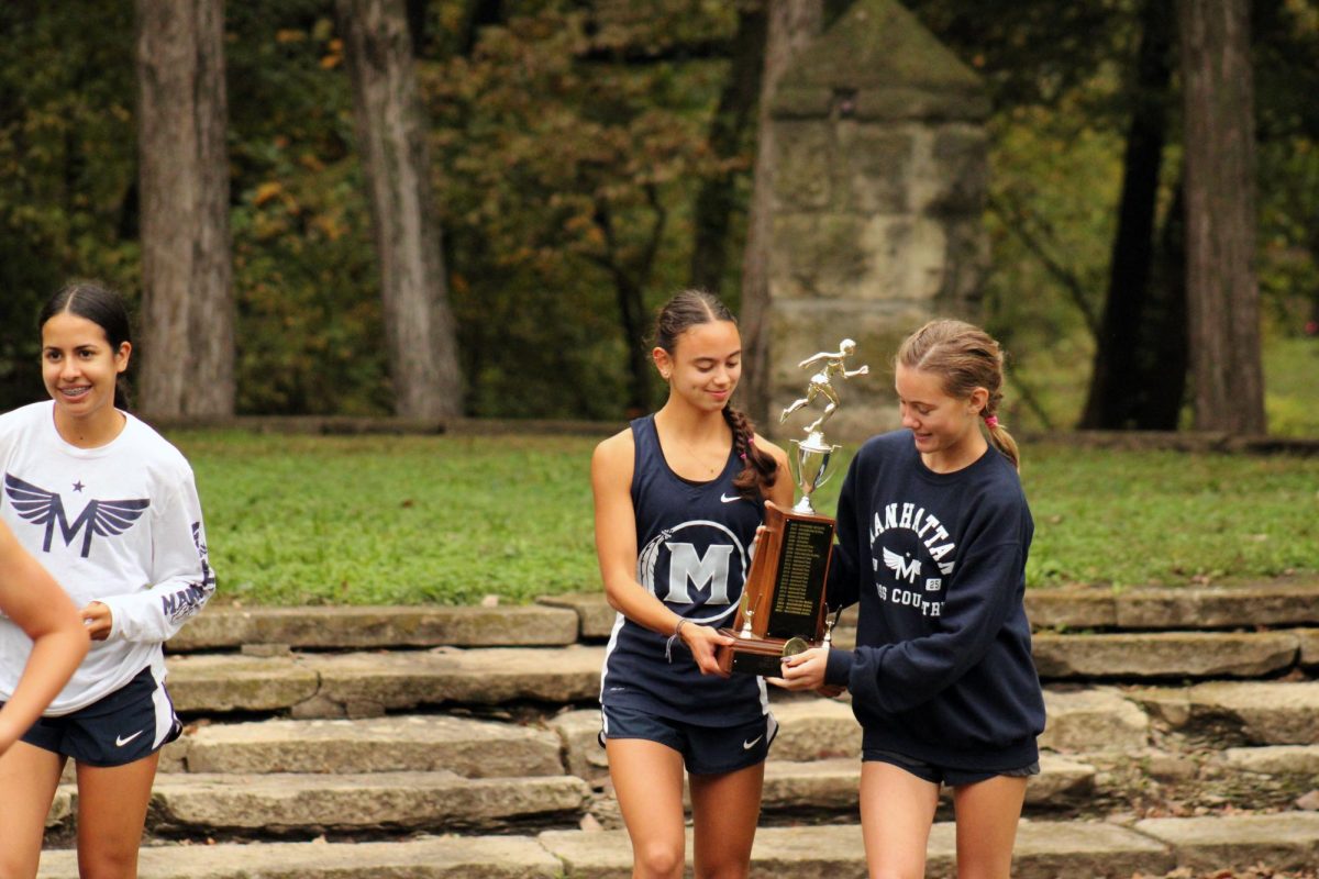 WOO!! Gabrielle Converse and Isla Spreer holding the Centennial League Trophy. Gabrielle and Isla got 1st and 3rd place respectfully. 