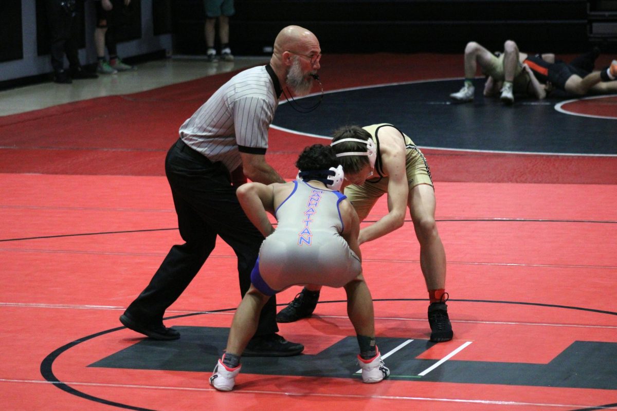 Tweet! the reff blose the wistle for the start of the mach bettwen Avery Ahalt and a wrestler from centeral. Avery pined the wrestler from Central in the first period earning Manhattan 6 team points.