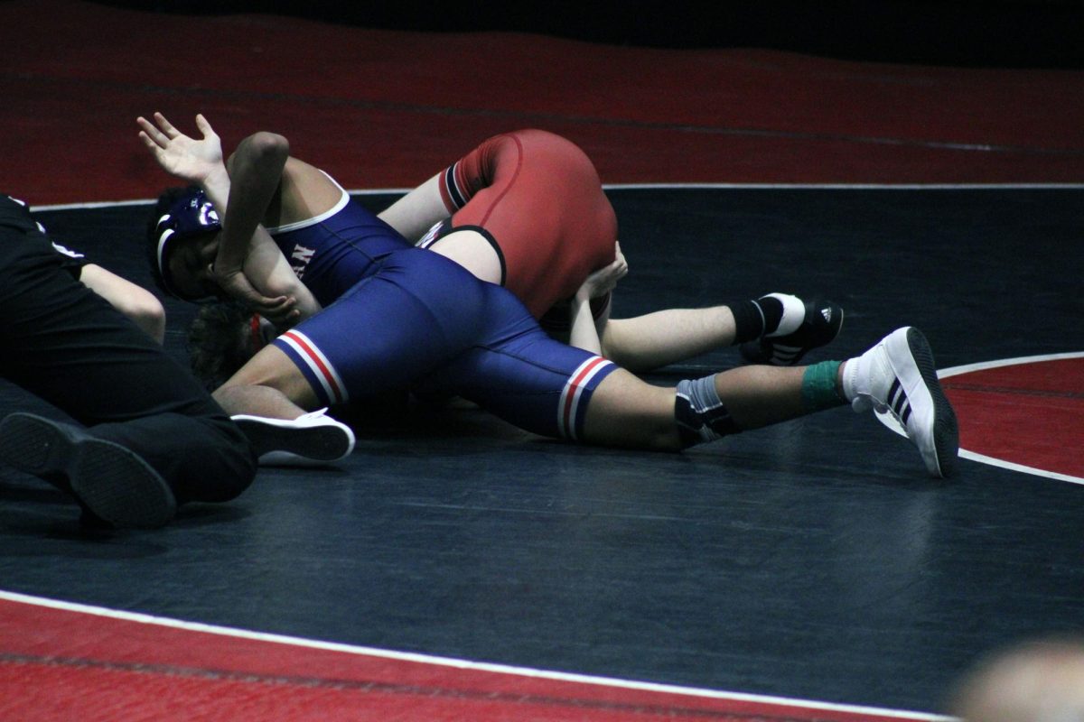 Whak! freshman Lio _____ pining an Emporea wrestler. Lio helped Manhattan win the torniment by pining him and geting 6 pions for Manhattan team. 