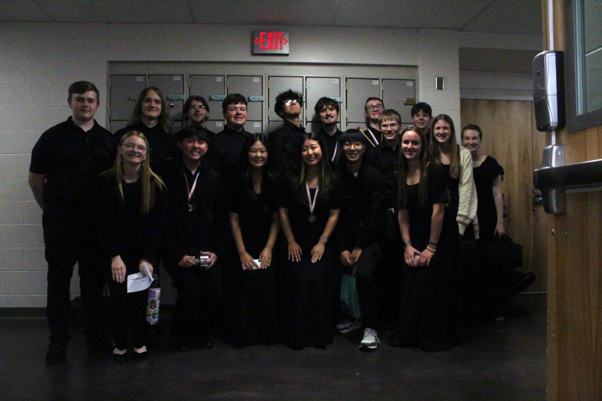 Post-show pose Honor band members pose for a group photo following their performance at the North Central District Honor Ensembles on Dec. 6. Students from 21 other schools came together to showcase their musical talent.