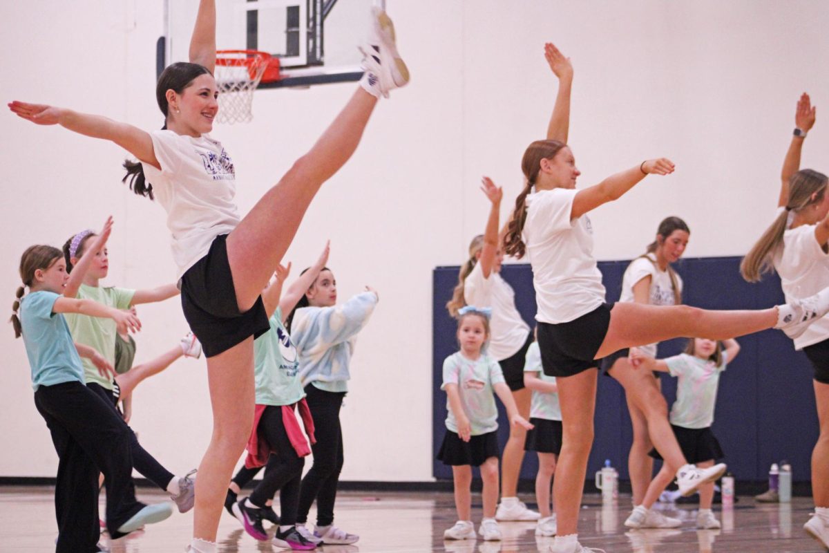 Unlocking the Joy of Dance On Feb. 16, 2026 the Manhattan High School dance team welcomed young elementary students to a mini dance clinic in the west gym. It was a day filled with fun as older dance students taught their younger counterparts how to perfect their kicks.