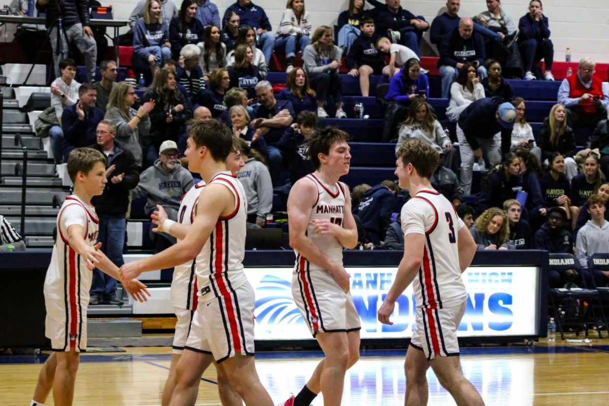 Victory, The Manhattan Indians celebrate their win against Hayden High. On Jan. 16, the Indians won 55-53 against Hayden High at home. 