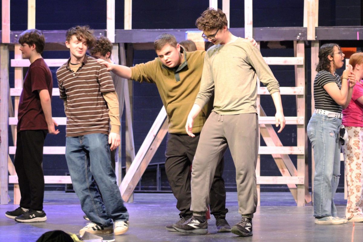 Grumpy strut. Junior Jack Ferrel grabs junior Gavin Howells and sophomore Micheal King to march them off stage. This happened on Feb. 25, 2026, as a rehearsal. The performances will be on Mar. 6,7, and 8, 2026 in Rezac Auditorium at MHS.