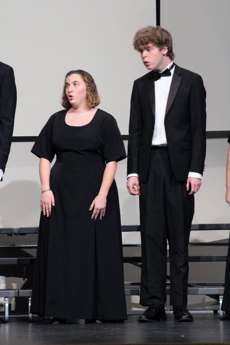 Vowels. Senior Leah Herring and senior Micah Pape sing in a Capella with each other and with the rest of the Manhattan High School Pops Choir for the Solo & Ensemble Regionals contest. This contest was on Apr. 11, and was hosted by MHS for high school musicians and vocalists to show off their skills and get to go to the next step, state!