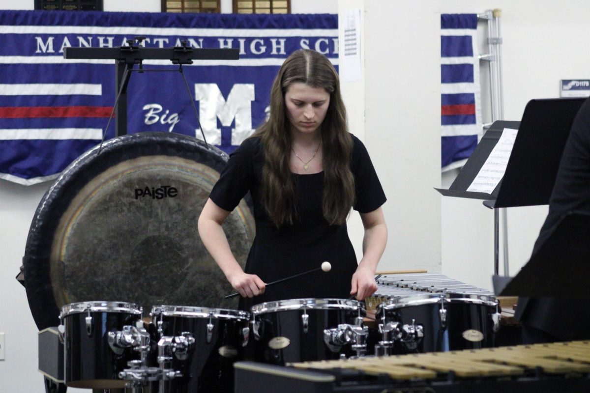 Drum set. Senior Brady Inman rocks out on one of the many percussion instruments during the Manhattan Percussion Quartet’s performance at the Solo & Ensemble Regionals event on Apr. 11. The time for this group was at 4:04pm, while some other group’s times are at around 8 in the morning.