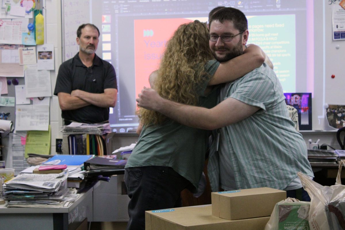 We meet again. Media and Publications teacher Kristy Nyp gives her past teacher’s assistant, Jared Shuff, an emotion-filled hug as she is surprised with the 2026 Jackie Engel Award. This award goes towards teachers and advisers who are nominated for their top-tier excellence in publication advising. The award was handed to Nyp on Apr. 23, during the 5th hour period and will be brought up once more during the State KSPA gathering.