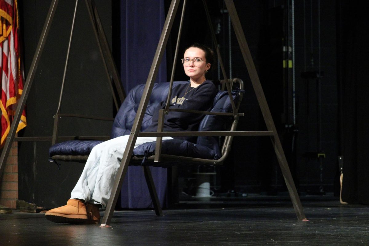 Serious swing. Junior Alexis Toews acts out her character for the tech day for the MHS Spring play, Proofs. A tech day is for the actors and crew to go through lines, work on scenes, make cues, set lights and more. The tech day for this rehearsal was on Apr. 26.