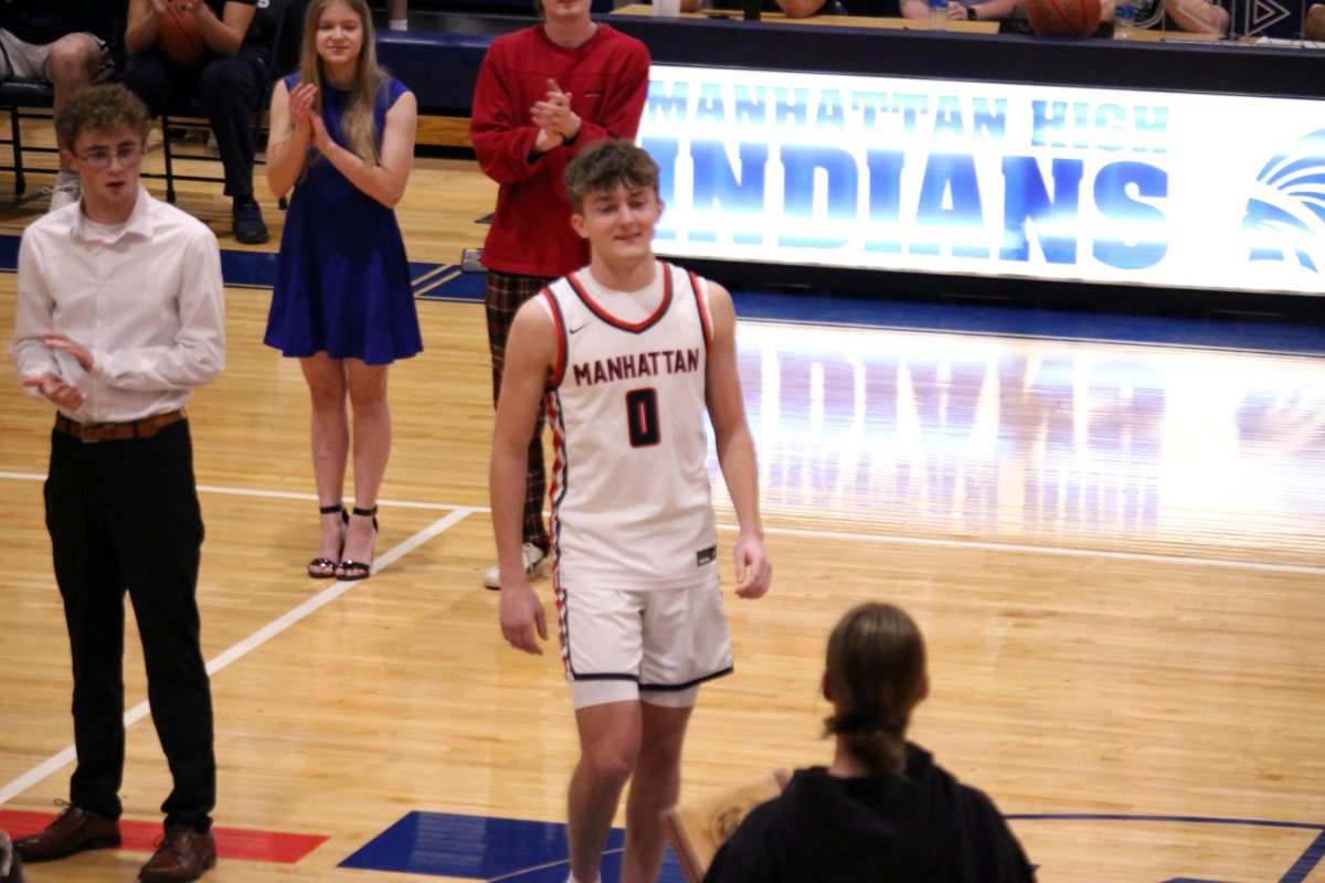 Crowned King. Senior Will Carpenter smiles as he is crowned Homecoming King. 