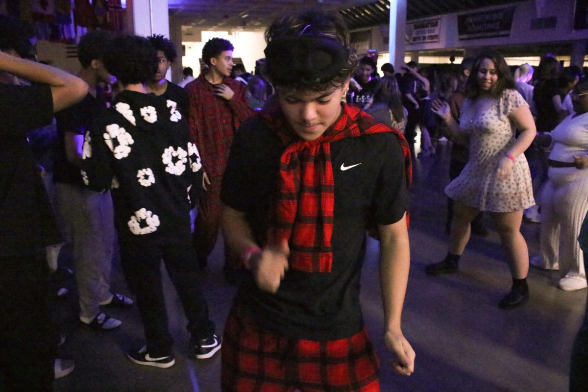 Freshman Jose Cuevas dances at the Snowcoming dance on Feb 13.