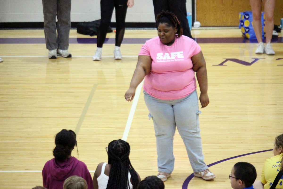Groups. Sophomore Joydae Johnson calls out numbers and points to the middle schoolers from Anthony Middle School to form three groups out of the PE class. The reason for the groupings is for the SADD club at Manhattan High School which teaches young kids about the dangers of addiction and the choices they could make and ones that they shouldn’t make. 
