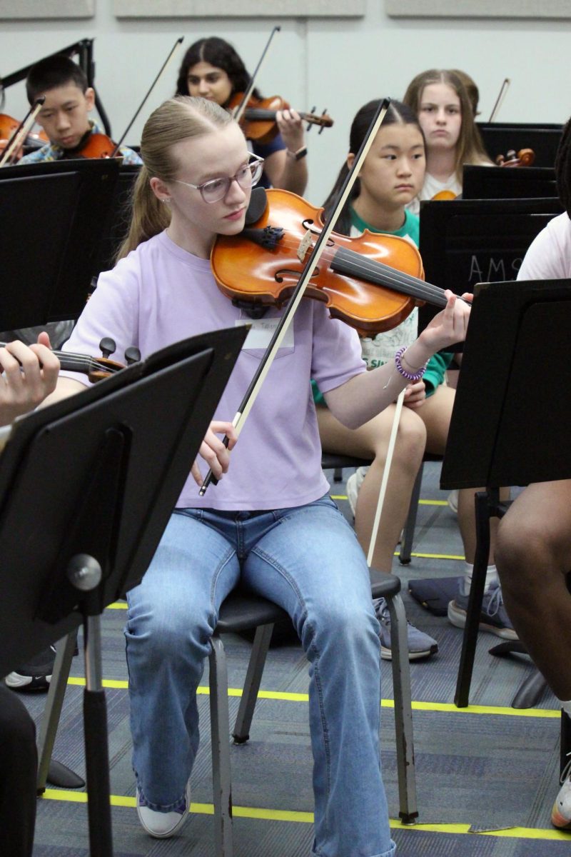 Focused and ready. Junior Casen Tallent plays along with the top Anthony Middle School orchestra as they prep for the end of the year and move up to high school during the Manhattan High School Symphonic Orchestra visit. The orchestra hopes to encourage the young 8th graders to join in the fun and keep playing in high school. The visit to the middle school was on Mar. 31