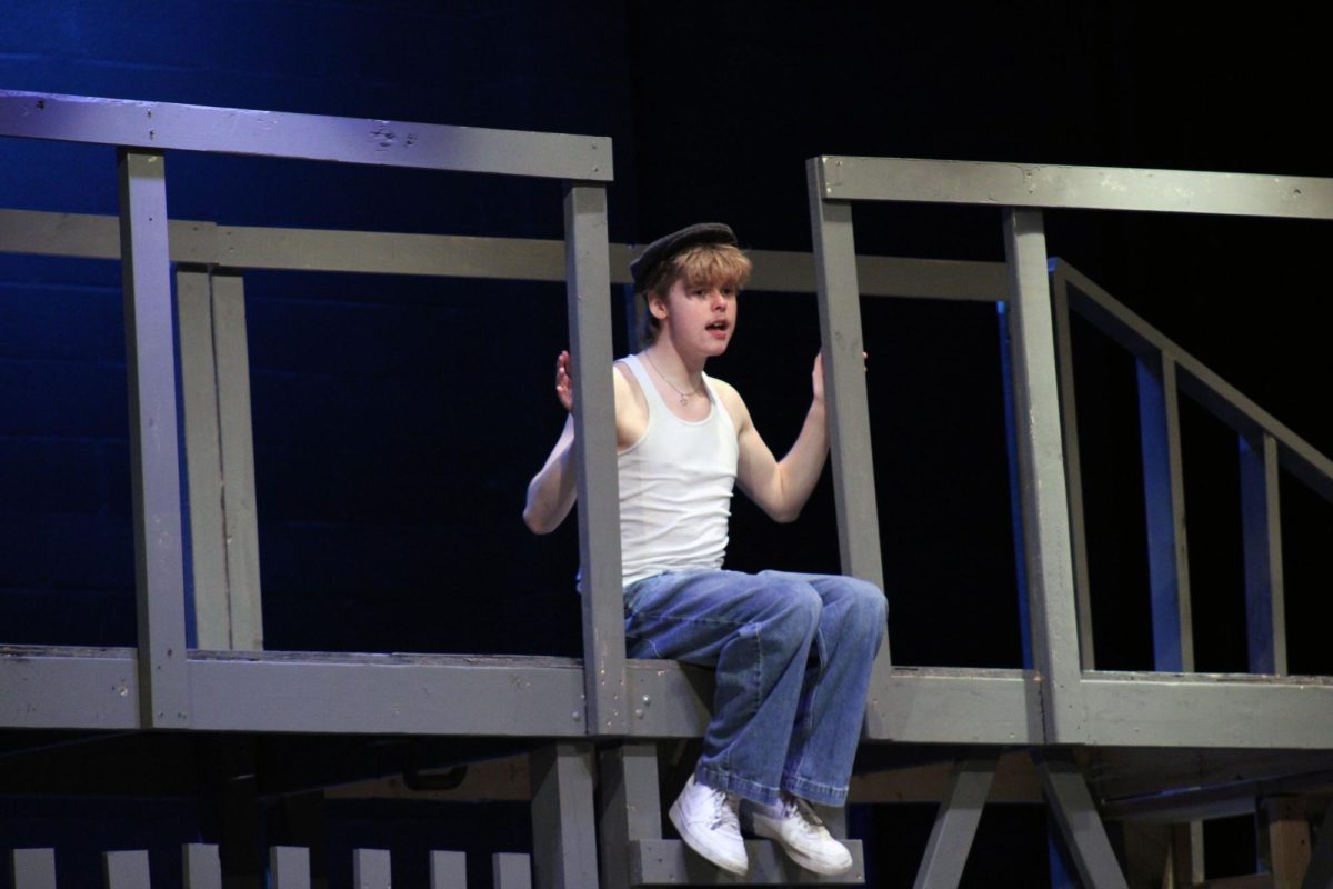 Senior Micah Pape sings his solo for the musical during rehearsal on March 1. 