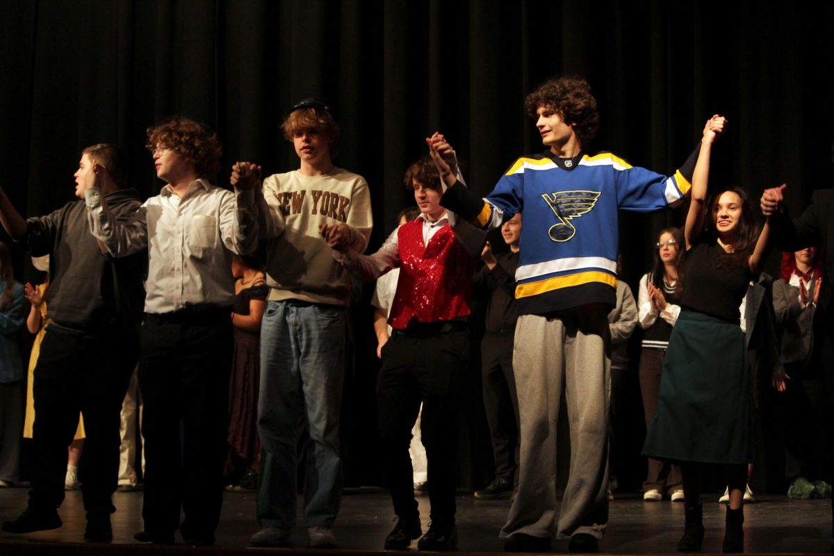 Taking a bow. After running through all the scenes the cast takes a practice bow.
