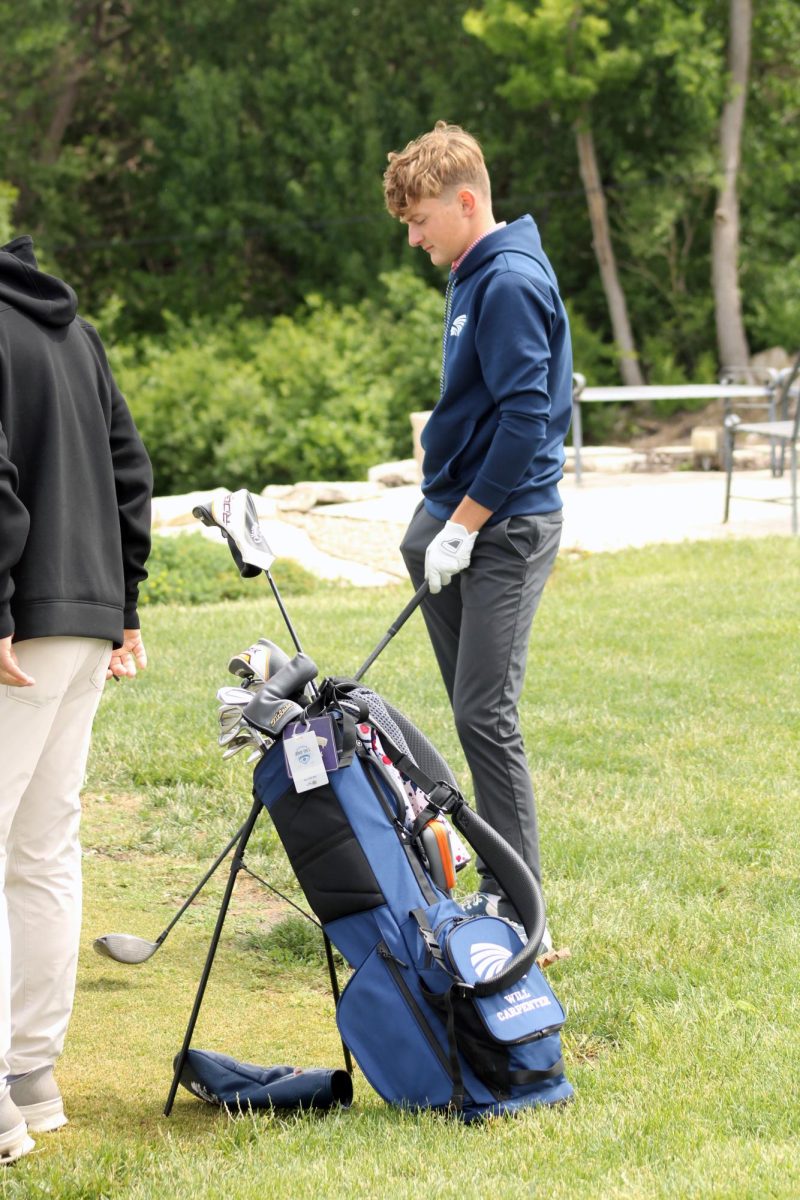 Teeing off. Senior Will Carpenter pumps himself off before he hits his first ball of Substate. The Manhattan High School Varsity Boys Golf Team Competed in the Substate tournament at Manhattan Country Club on May 20.