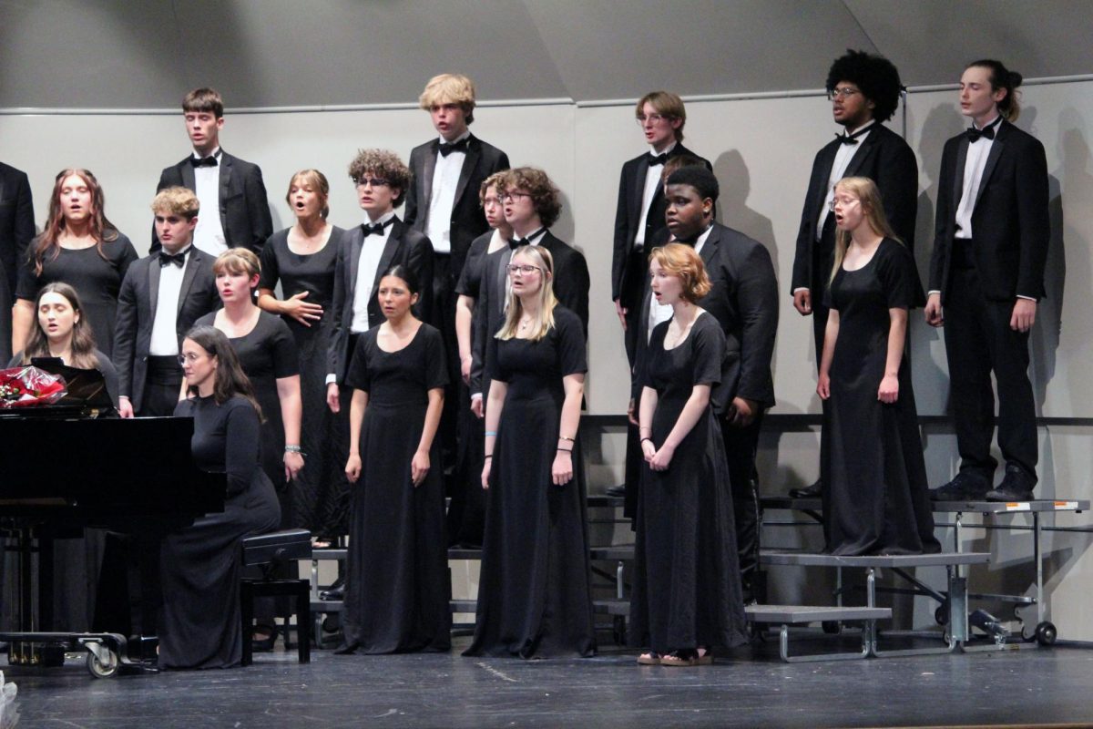 Sing together. The Manhattan High School Chamber Choir sings along as their accompanist, Cheryl Savage, plays the piano. This was during the MHS Final Choir Concert on May 13, when seniors say their last goodbyes to the Rezac stage that they know and love.