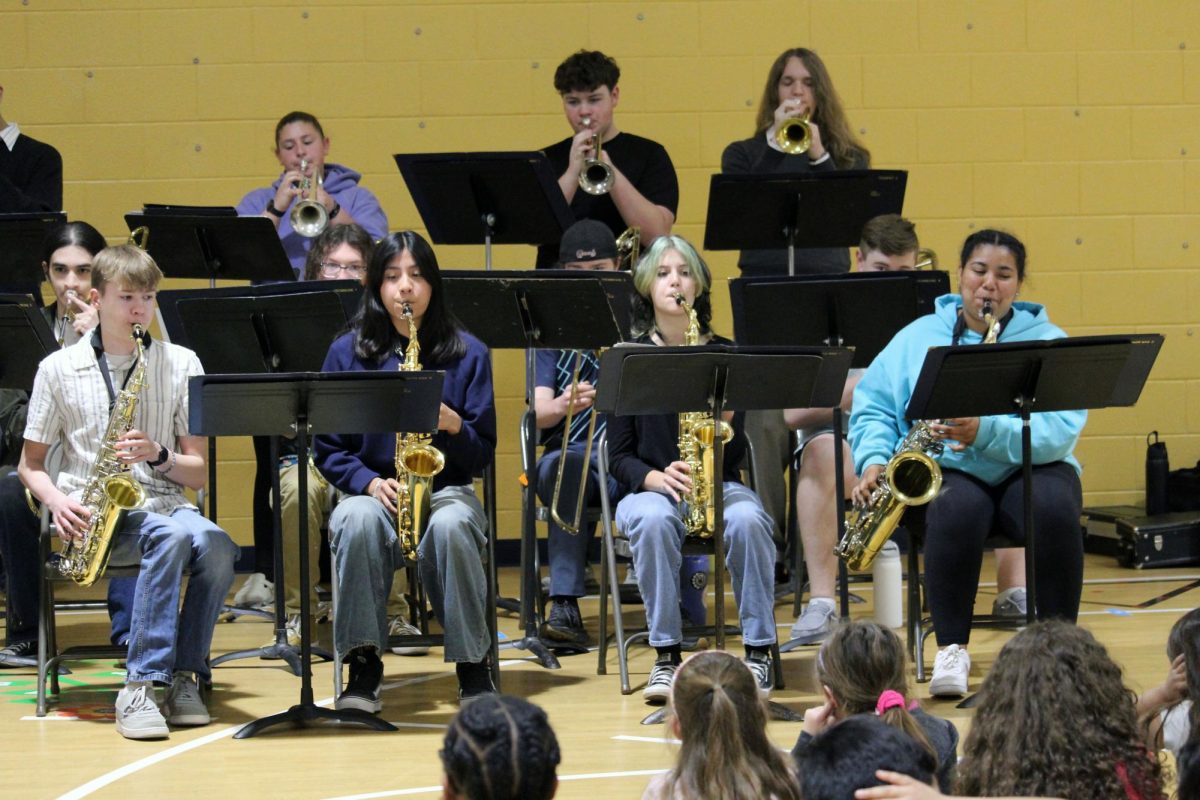 Play time. The Manhattan High School Jazz Band wind players play a plethora of fun tunes and songs for Ogden Elementary School. The Jazz Band group is officially named MHS Blue Notes Jazz band, where they get to change up the regular rules of band and get to improv and swing their notes with their friends. The visit to Ogden Elementary was on May 1.
